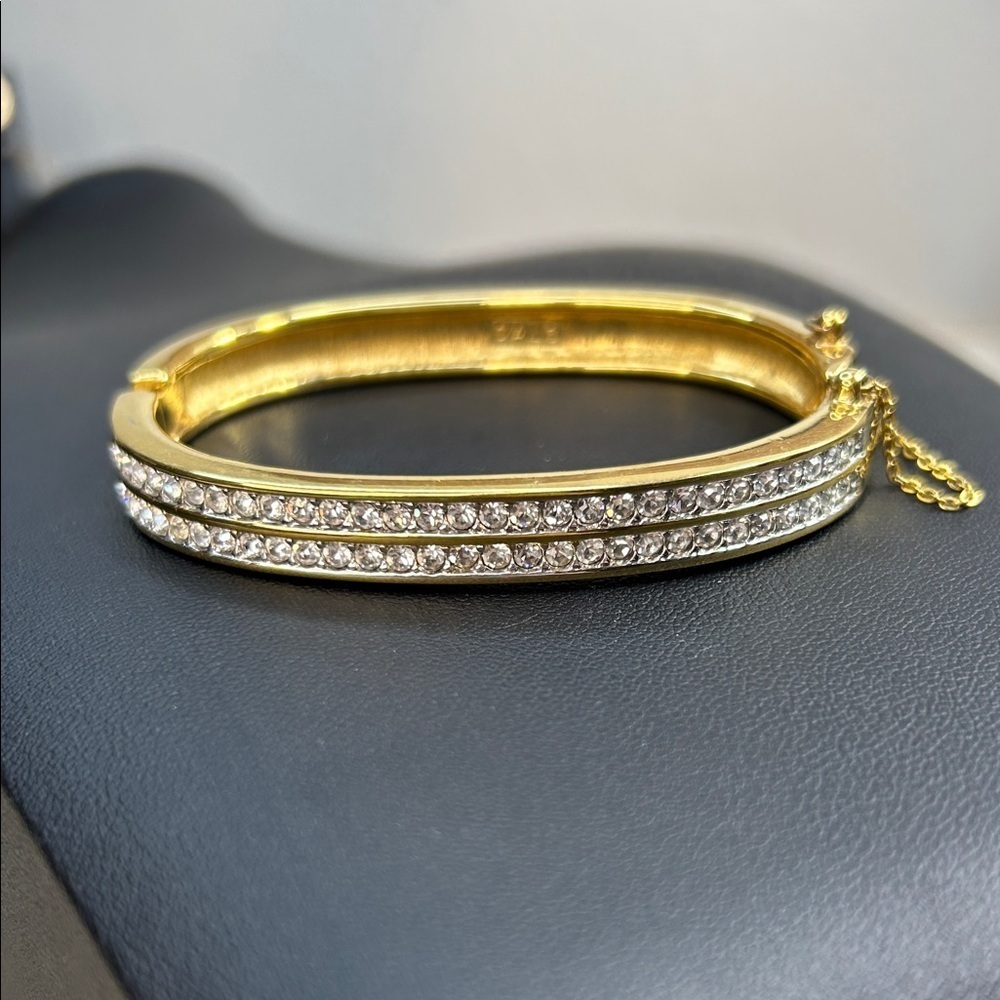 Vintage Swarovski gold-tone hinged bracelet with clear crystals marked S.A.L
